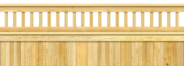 Close-up of a wood fence with turned wooden spindles lined up along the top rail above the solid board section